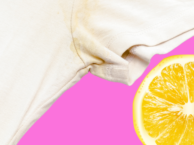 Weißes T-Shirt mit Deofleck auf pinkem Hintergrund, daneben Zitrone