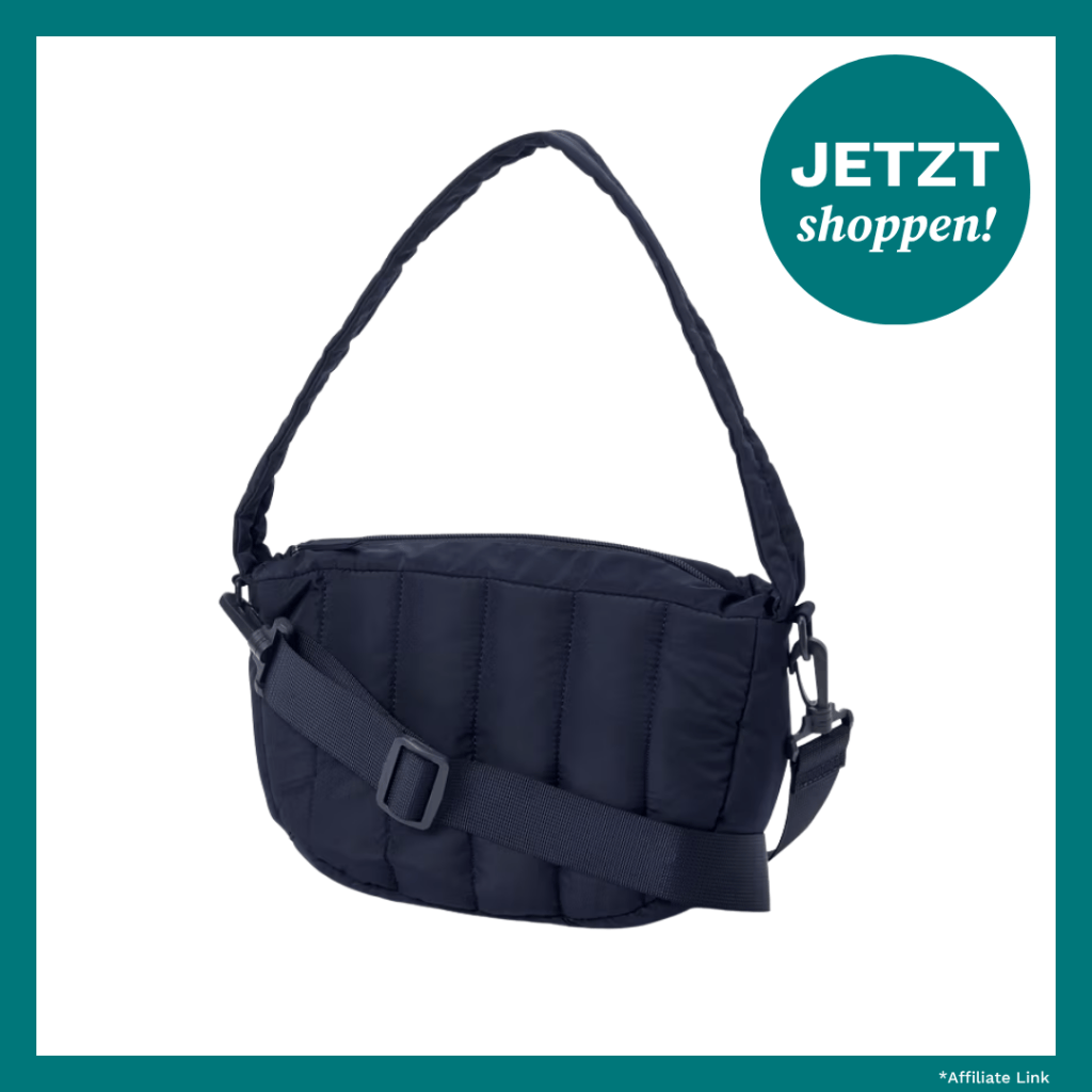 Dunkelblaue gesteppte Tasche mit viel Stauram.
