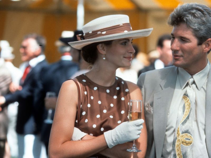 Julia Roberts has a drink with Richard Gere in a scene from the film 'Pretty Woman', 1990. (Photo by Buena Vista/Getty Images)
