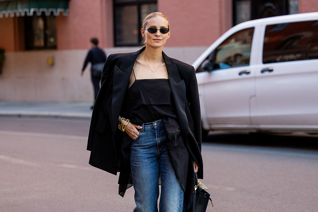 Tine Andrea wears black blazer, jeans, black top Hermes bag during Oslo Fashion Week on August 26, 2025 in Oslo, Norwegen