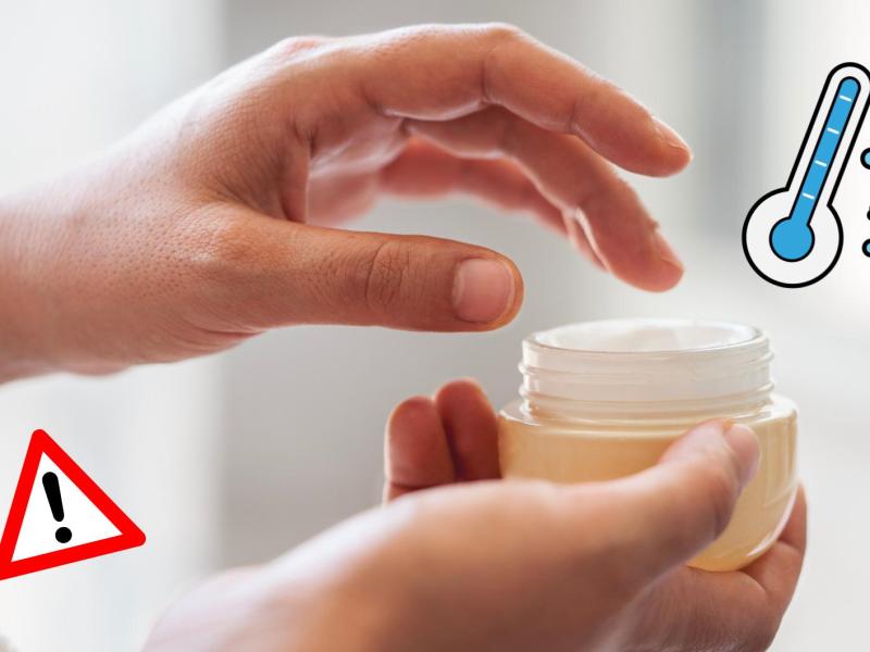 Frau nimmt sich etwas Creme aus einer Cremedose.